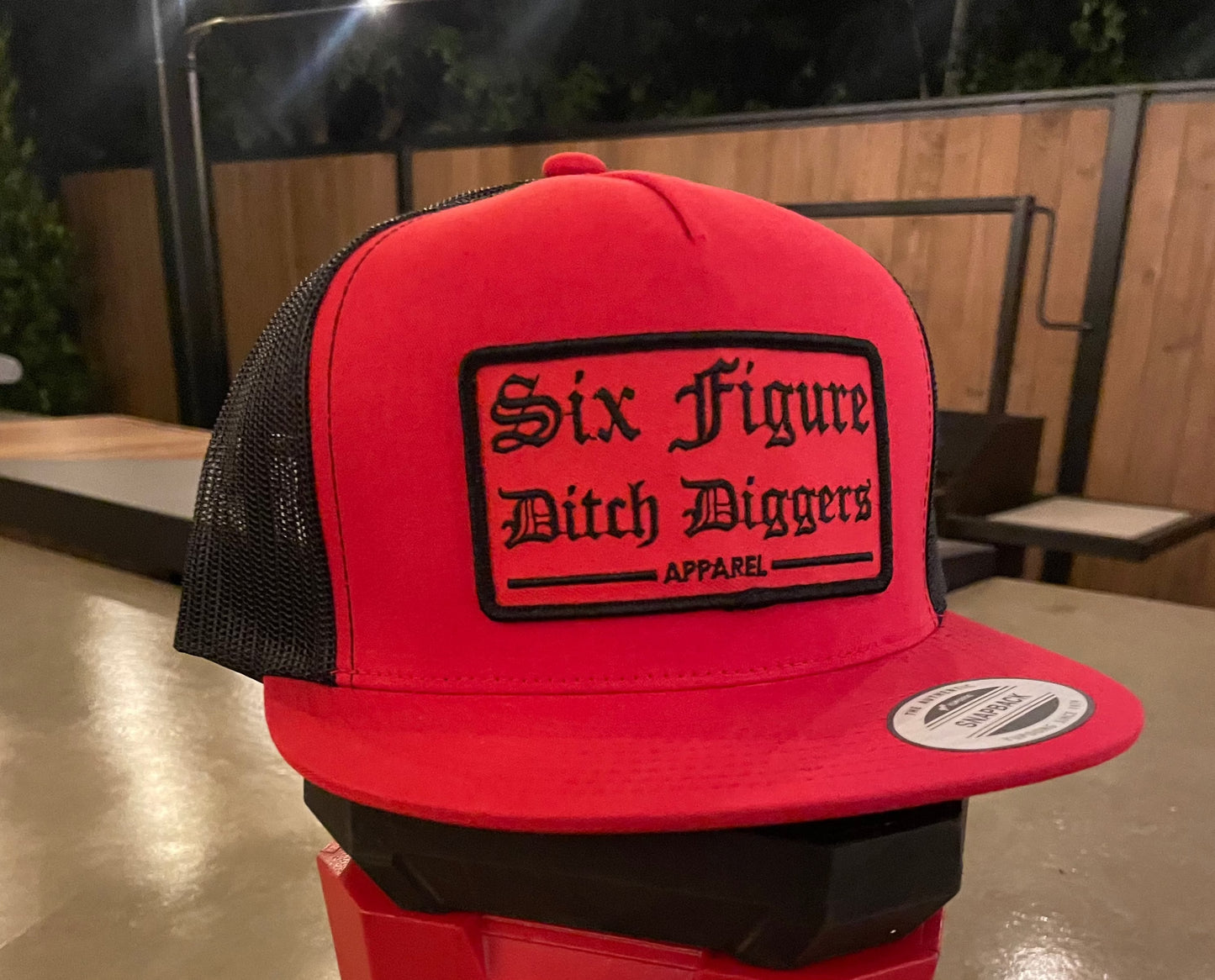Red Patch Six Figure Flat Bill Trucker Hat